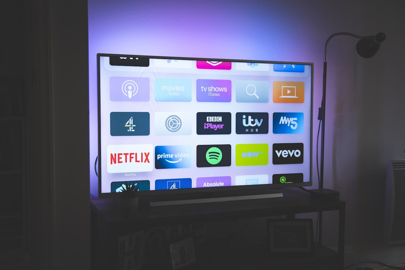 A flat-screen television mounted level on the wall