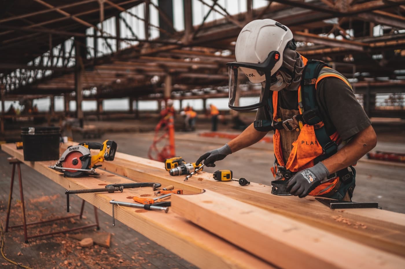 A Nomad worker in safety gear handling heavy work